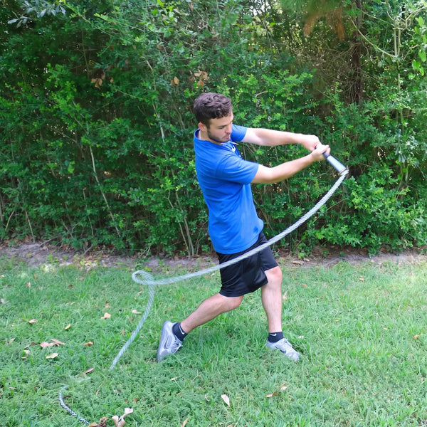 Baseball hitter driving SpeedChain® Batting Chain through the hitting zone at simulated contact, training bat speed and power.