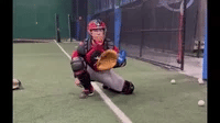 GIF of a catcher receiving with the KHAOS® Waterboy Jr, a blue water-and-air-filled cylinder designed to create instability, enhancing reaction time, glove control, and dynamic stability during training.