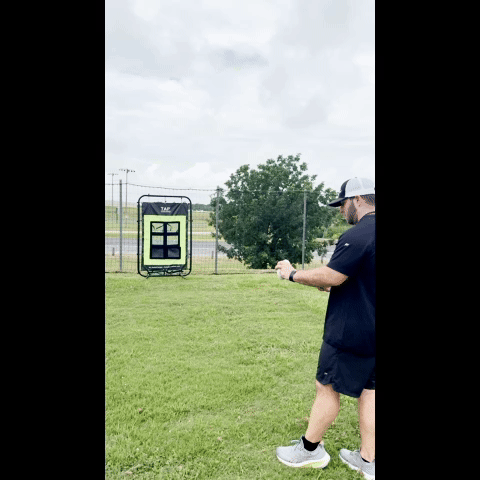 Athlete throwing a Yakkeraid ball into a 6-pocket training target