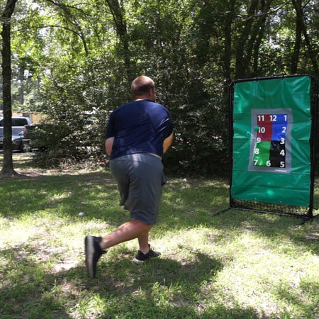 Athlete throws an 8oz weighted baseball toward a target, focusing on arm health, strength development, and increased throwing velocity.