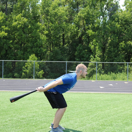 The athlete is using a heavier bell club to swing on the outside of the body. He is using his hips, glutes, and core to swing the bell club forward. This really increases strength in the posterior chain.