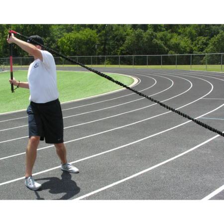 Athlete executing an upward crossbody rotation, engaging core muscles to enhance strength, stability, and controlled movement during functional training.