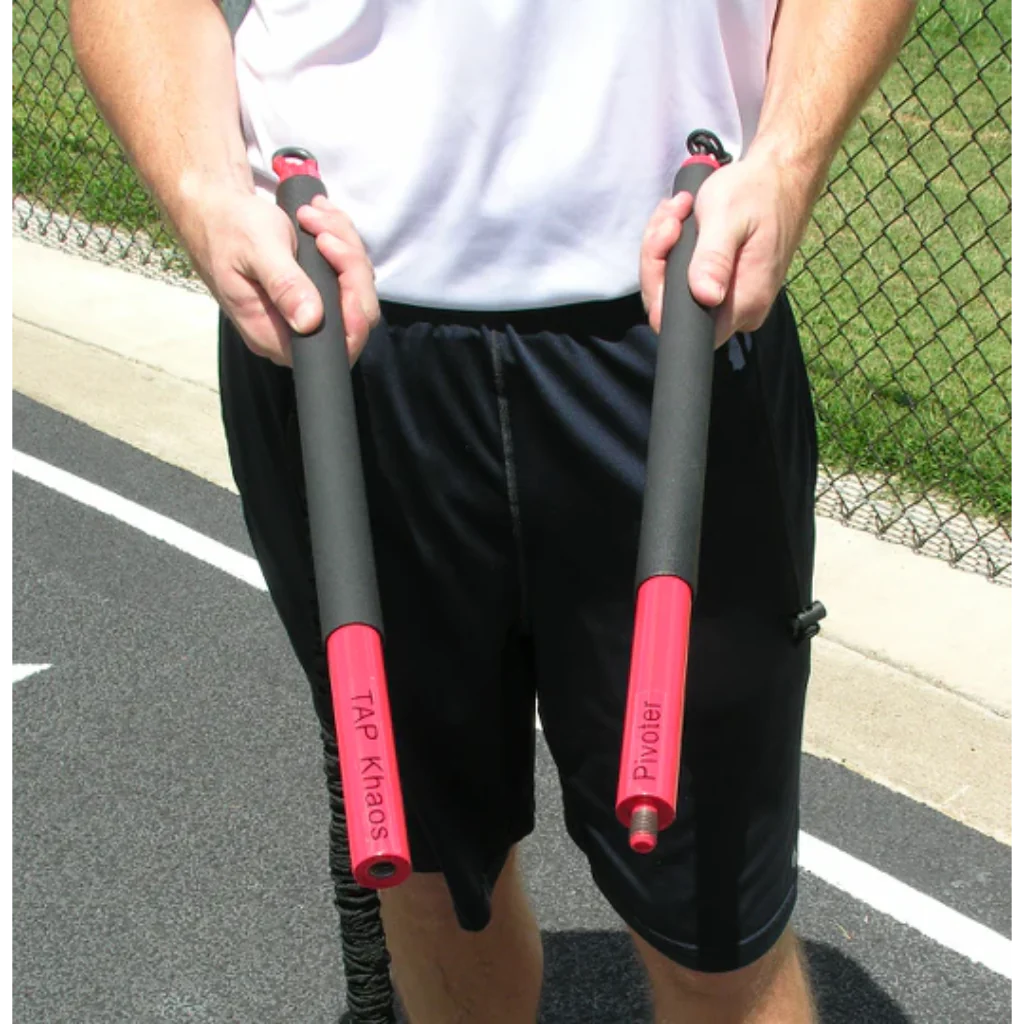 Athlete holding both ends of the KHAOS® Pivoter Bar, preparing to store it in its carrying case for convenient transport and protection.