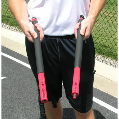 Athlete holding both ends of the KHAOS® Pivoter Bar, preparing to store it in its carrying case for convenient transport and protection.