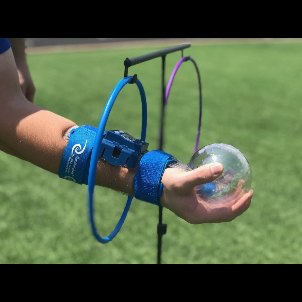 Athlete using Shoulder Sphere with hand through Shoulder Sphere Coaching Rings to activate and strengthen rotator cuff muscles during dynamic shoulder training.