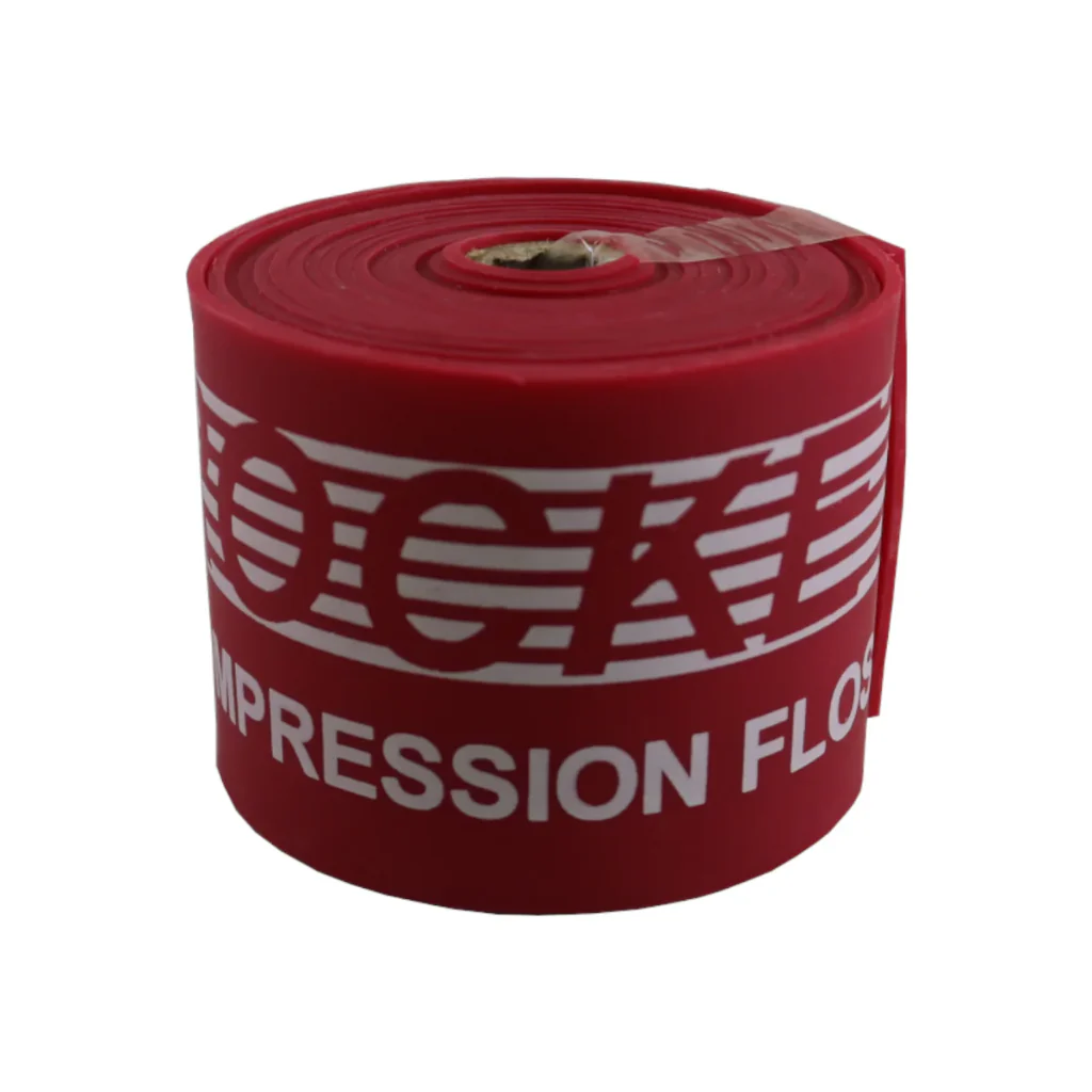 Red Rocket Wrap Compression Floss rolled up tightly, highlighting its X-Heavy resistance level, compact form, and durable natural latex material.
