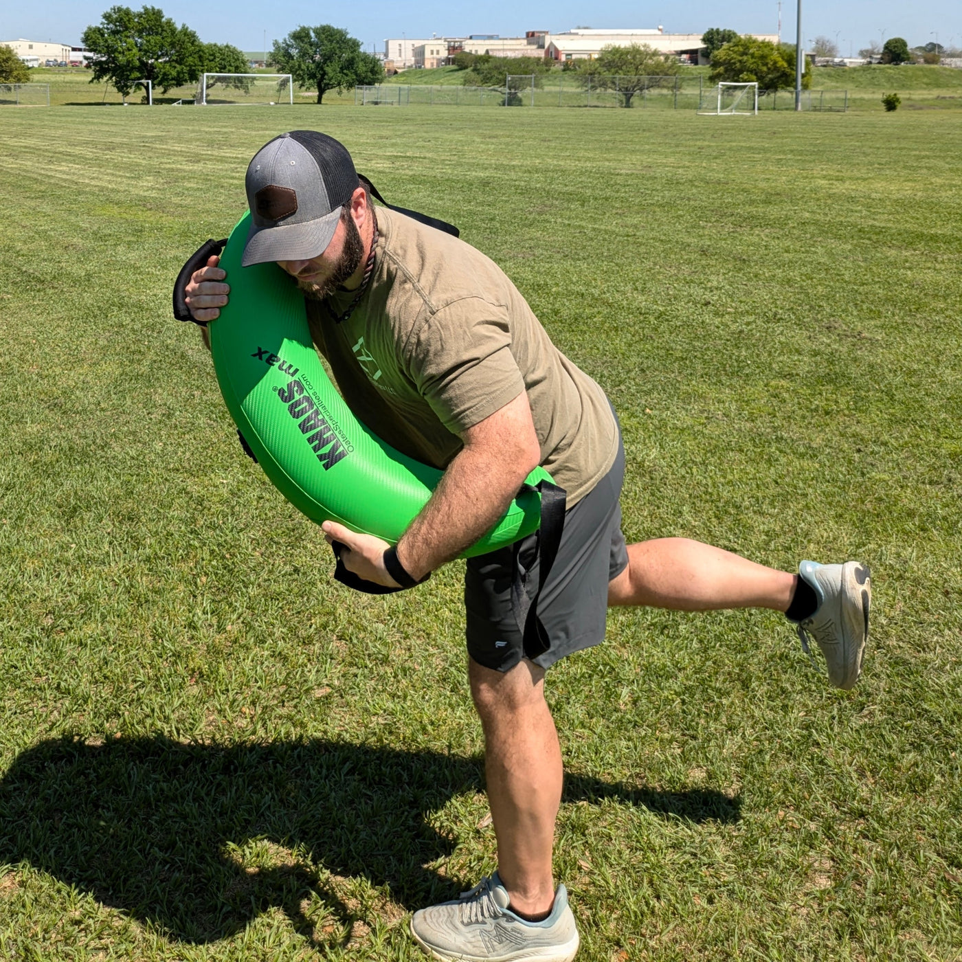 An athlete performs a simulated pitching motion with the Bulgarian Water Bag to train rotational strength with the shifting forces of water.