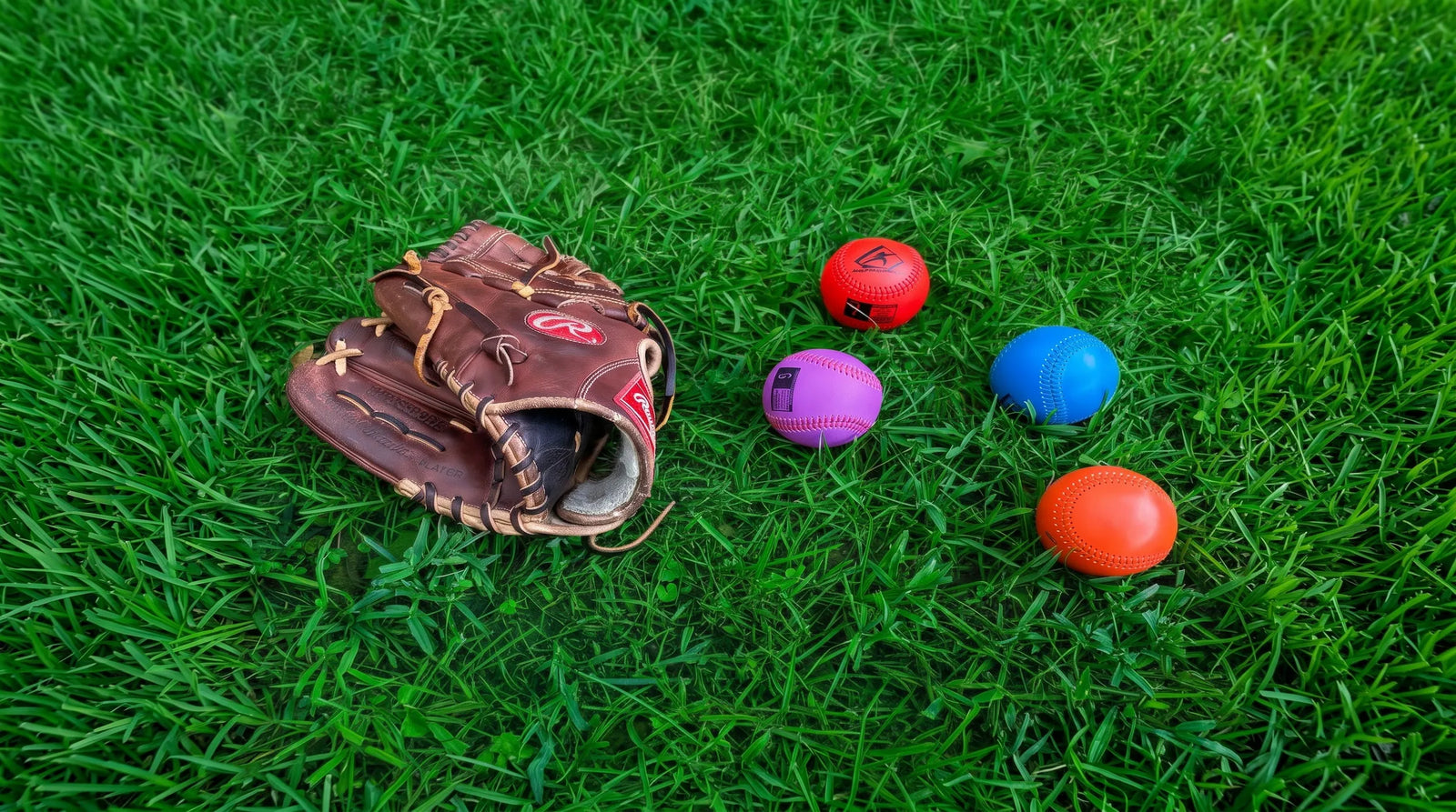 The Pitching Range Weighted Balls laid out in a training environment.