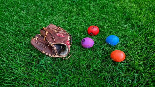 The Pitching Range Weighted Balls laid out in a training environment.