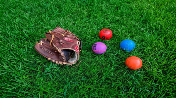 The Pitching Range Weighted Balls laid out in a training environment.