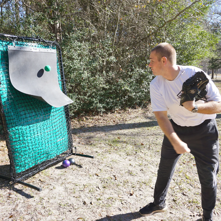 Athlete performs a dynamic warm-up drill with a TAP® Mini-Medicine Ball on a plyo mat.