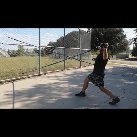 Athlete training arm side and glove side strength using sheathed resistance tubing.