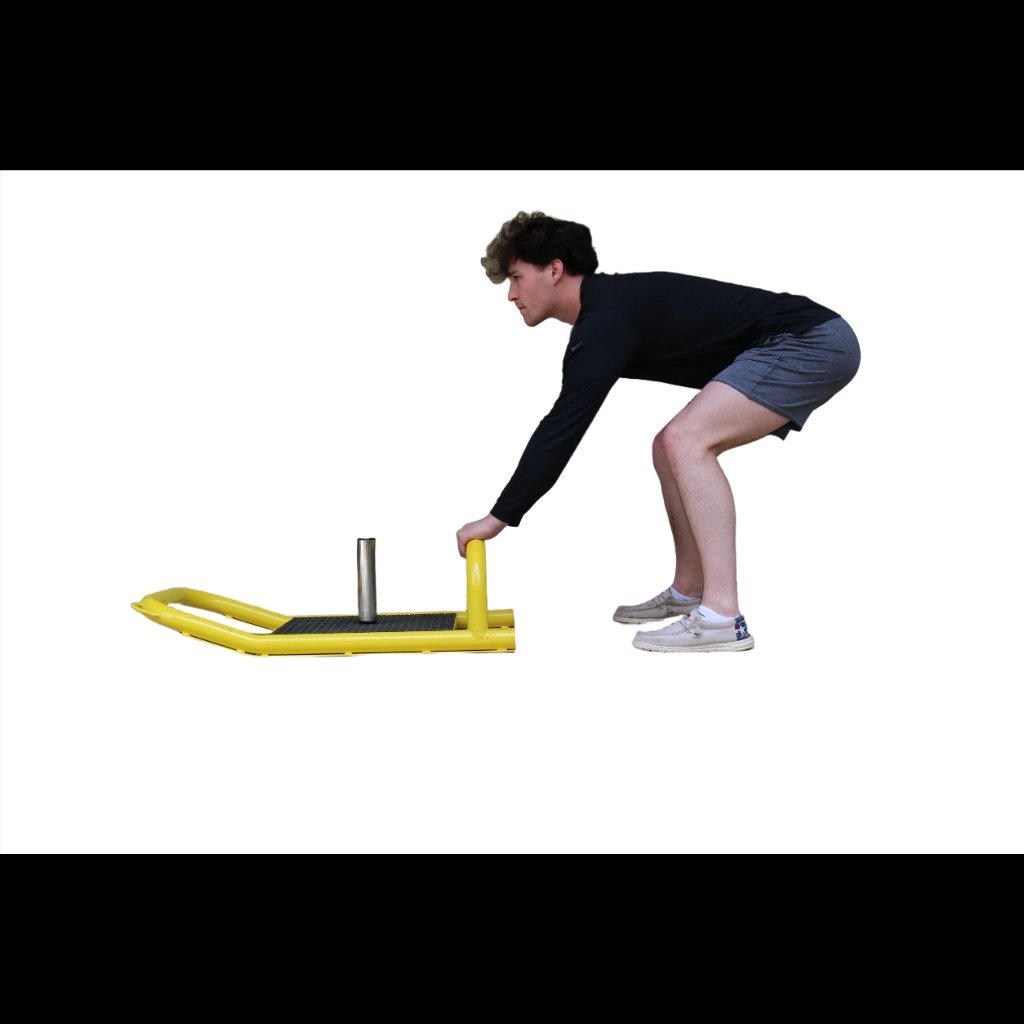Resistance Sled being grabbed as the athlete prepares to drag the sled in reverse.