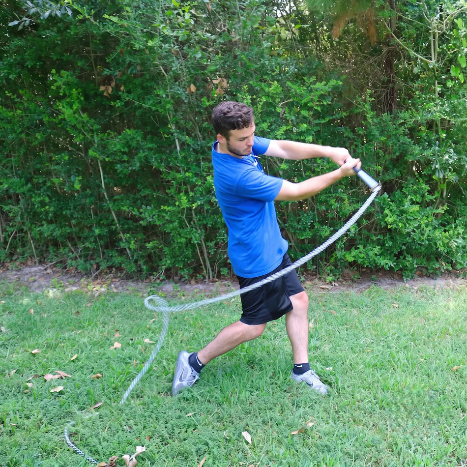 Baseball hitter driving SpeedChain® Batting Chain through the hitting zone at simulated contact, training bat speed and power.