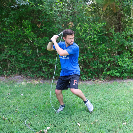 Baseball player in batting stance holding SpeedChain® Batting Chain before starting swing.