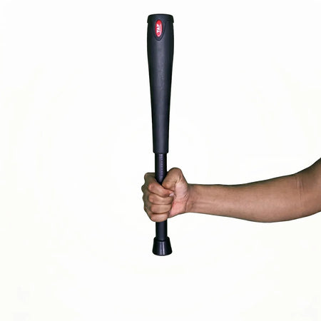 TAP® Bell Club 2KG being held straight up in one arm demonstrating leveraged weight.