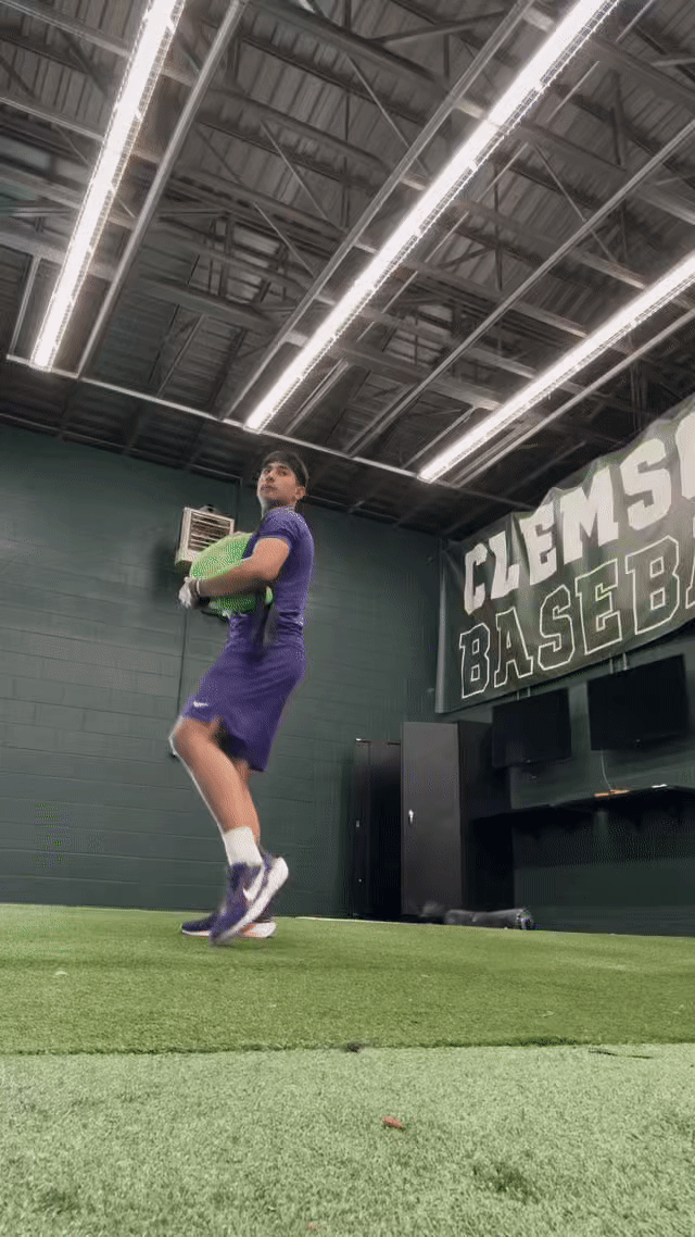 Baseball pitcher training with the KHAOS® Bulgarian Water Bag, utilizing shifting water resistance to activate core stabilizers, build strength, and refine pitching mechanics for optimal performance.