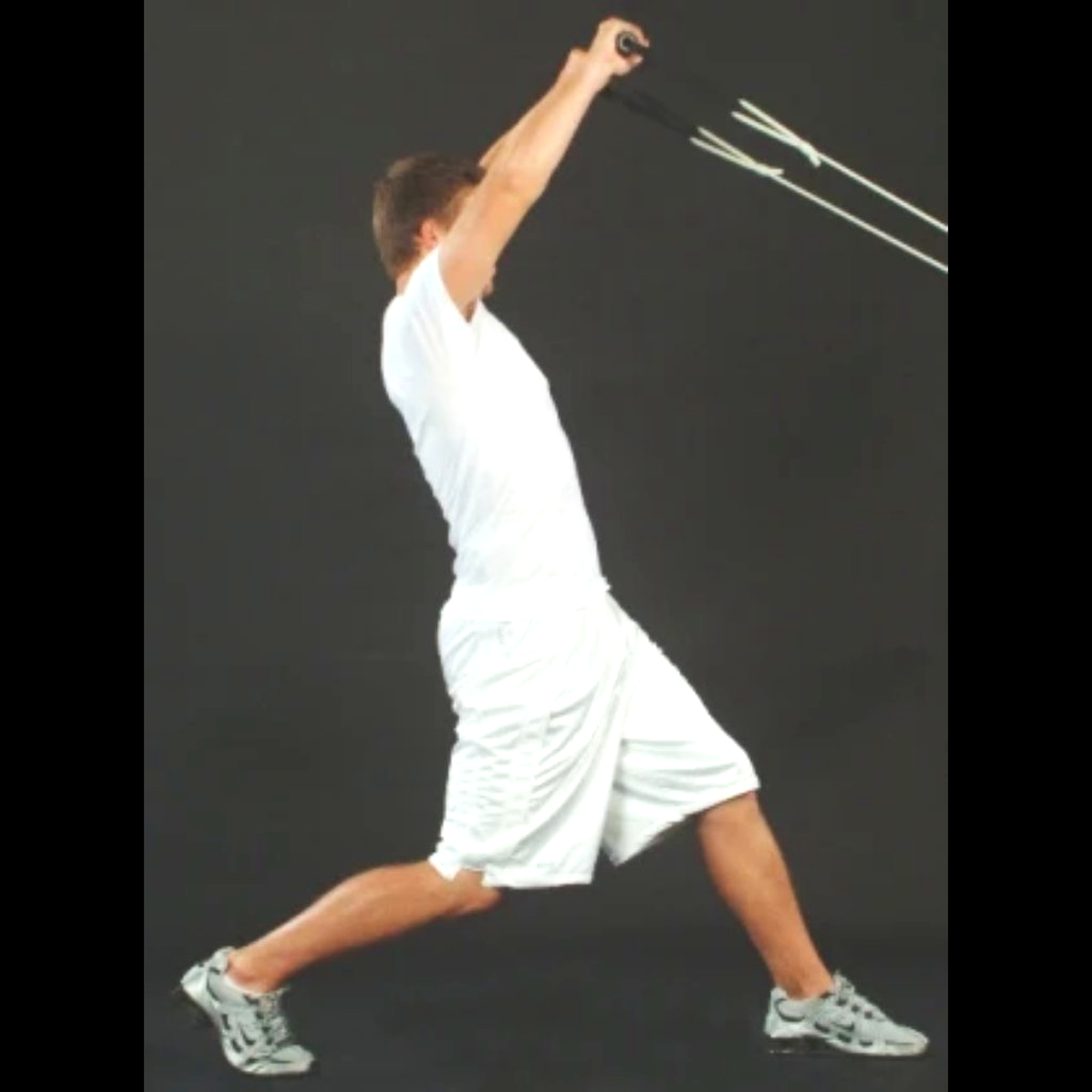Dynamic Arm Tubing being pulled above the head to improve strength of shoulders.