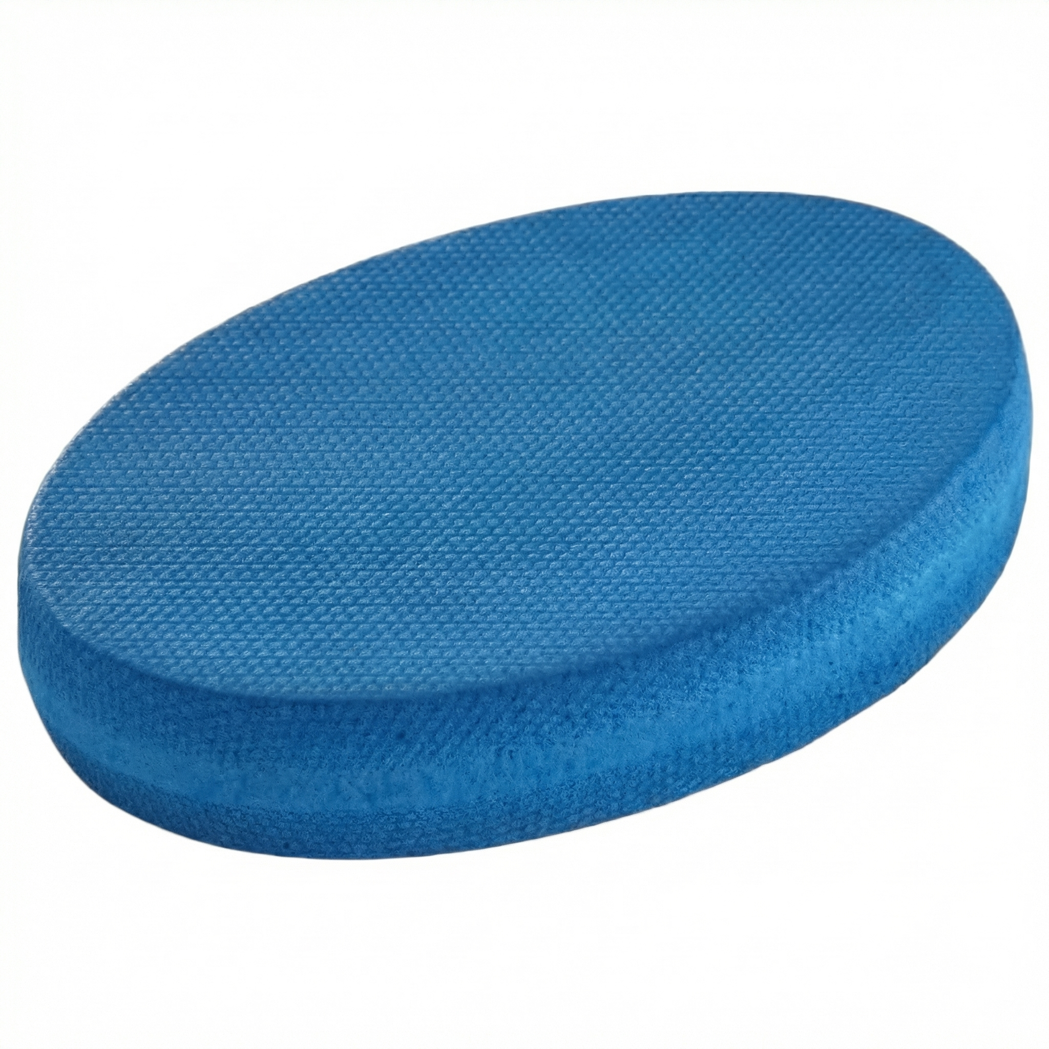 Oval Balance Pad featuring a firm, textured surface, designed to provide an unstable variable stimulus for lead-side stabilization and kinetic chain organization for increased power.
