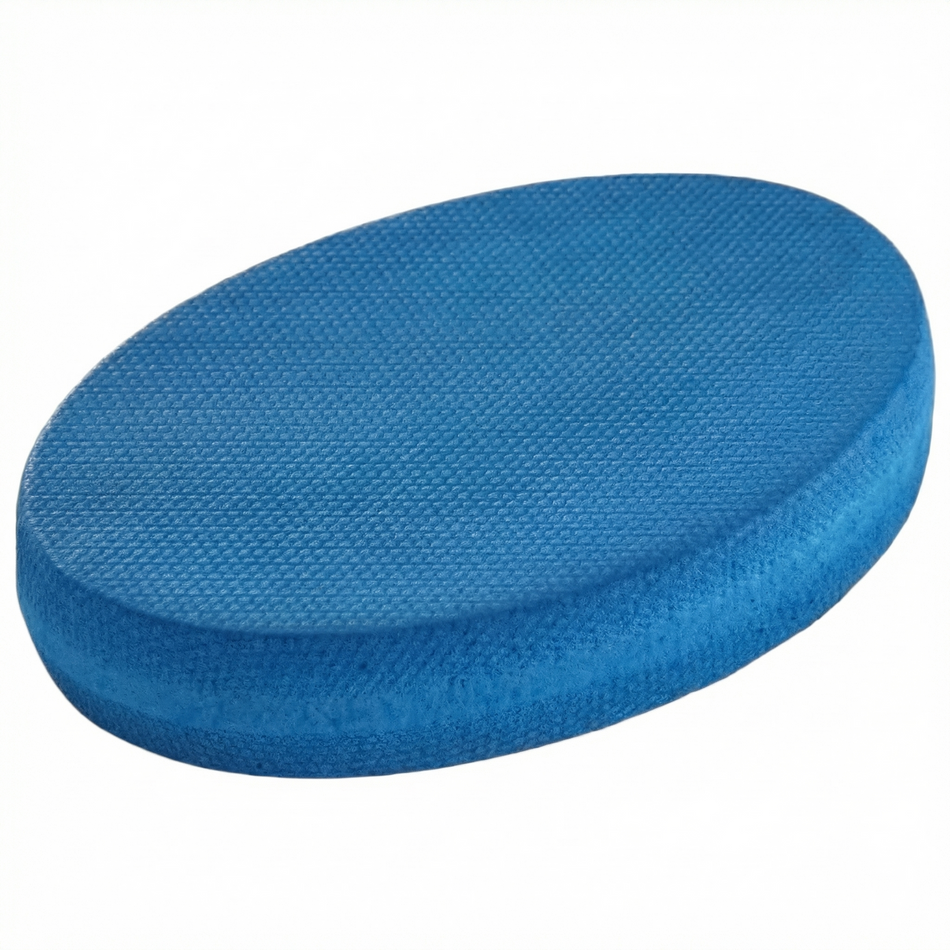 Oval Balance Pad featuring a firm, textured surface, designed to provide an unstable variable stimulus for lead-side stabilization and kinetic chain organization for increased power.