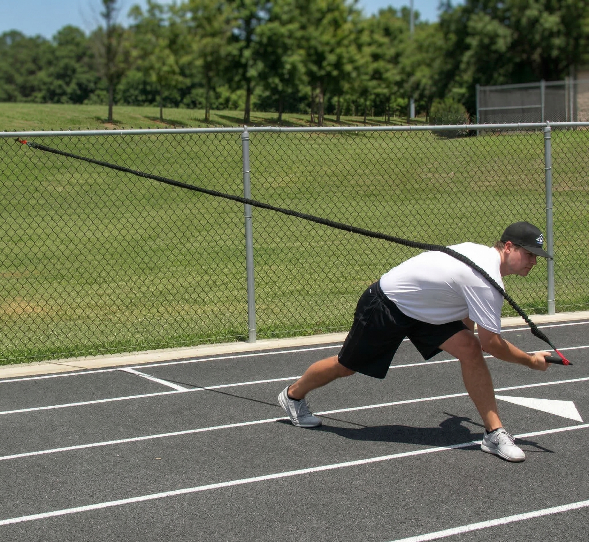 Athlete performing a full-body chop with the KHAOS Pivoter, utilizing elastic rhythmic perturbations to drive lead-side stabilization and kinetic chain organization for increased power.