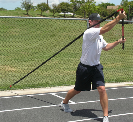 Athlete performing an upward crossbody chop with the KHAOS Pivoter, utilizing elastic rhythmic perturbations to drive lead-side stabilization and kinetic chain organization for increased power.