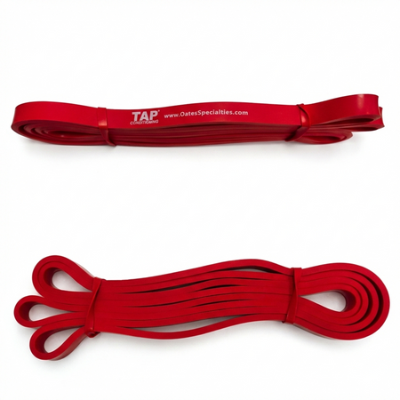 A Red (Light - 1/2") TAP® Giant Flat Band, representing the entry-level resistance in the developmental hierarchy. This 41-inch continuous loop is utilized primarily for low-load rhythmic activation and muscle-awakening patterns during the Prepare phase. Its calibrated tension allows youth athletes to rehearse multi-planar movements without compromising structural integrity, and serves mature athletes as a tool for assisted mobility and recovery-focused Restore blocks.