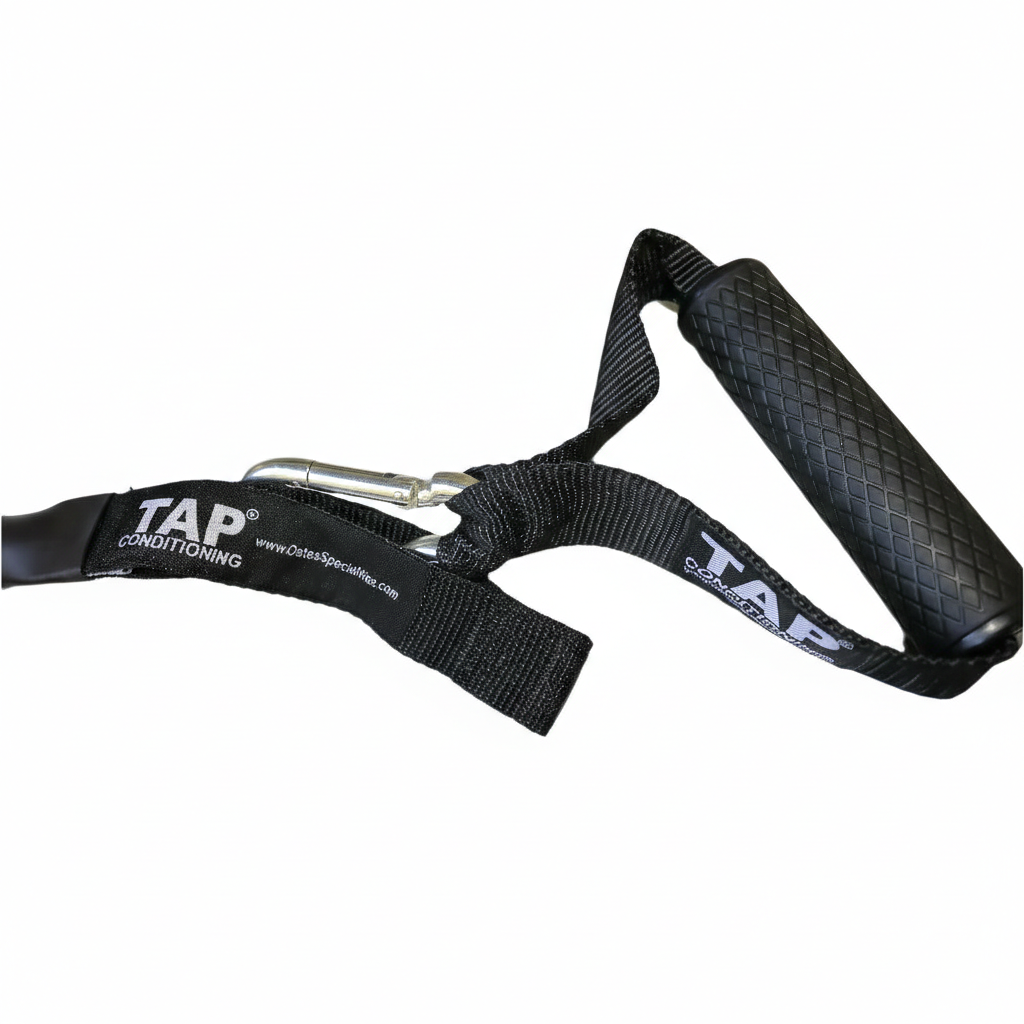 A close-up of the TAP® resistance tubing handle, featuring a high-traction rubberized grip and reinforced nylon webbing. The ergonomic design ensures consistent tactile feedback during kinetic chain integration, while the snap-hook closure provides a secure, low-friction anchor point designed for the rigors of professional training environments.