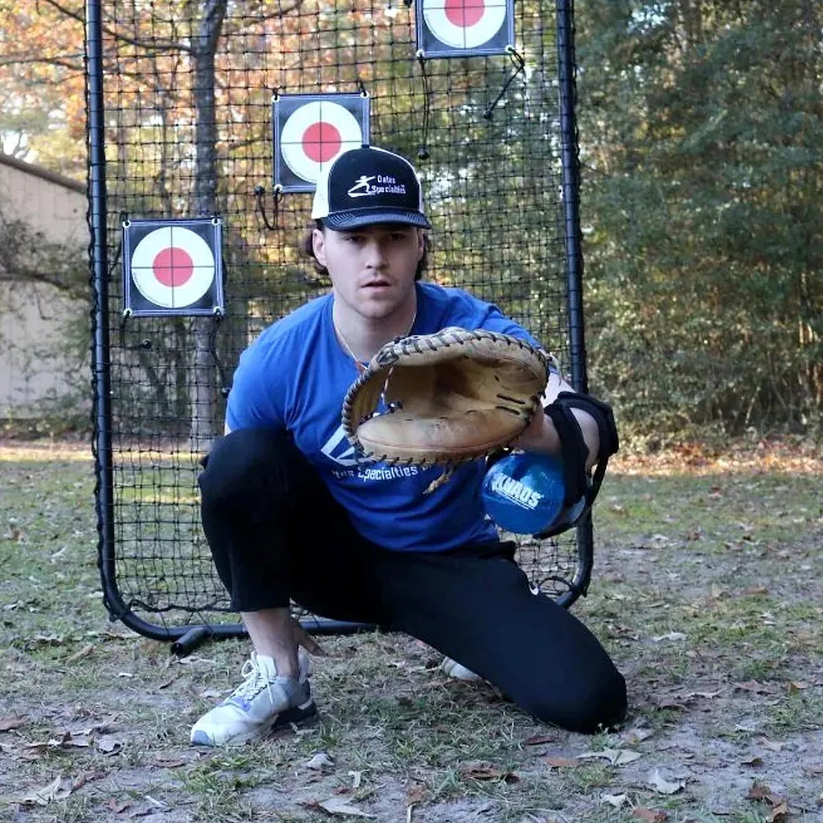 Catcher utilizing the KHAOS Waterboy Jr. on the lead forearm to drive lead-leg stabilization and kinetic chain organization through dynamic water perturbations.