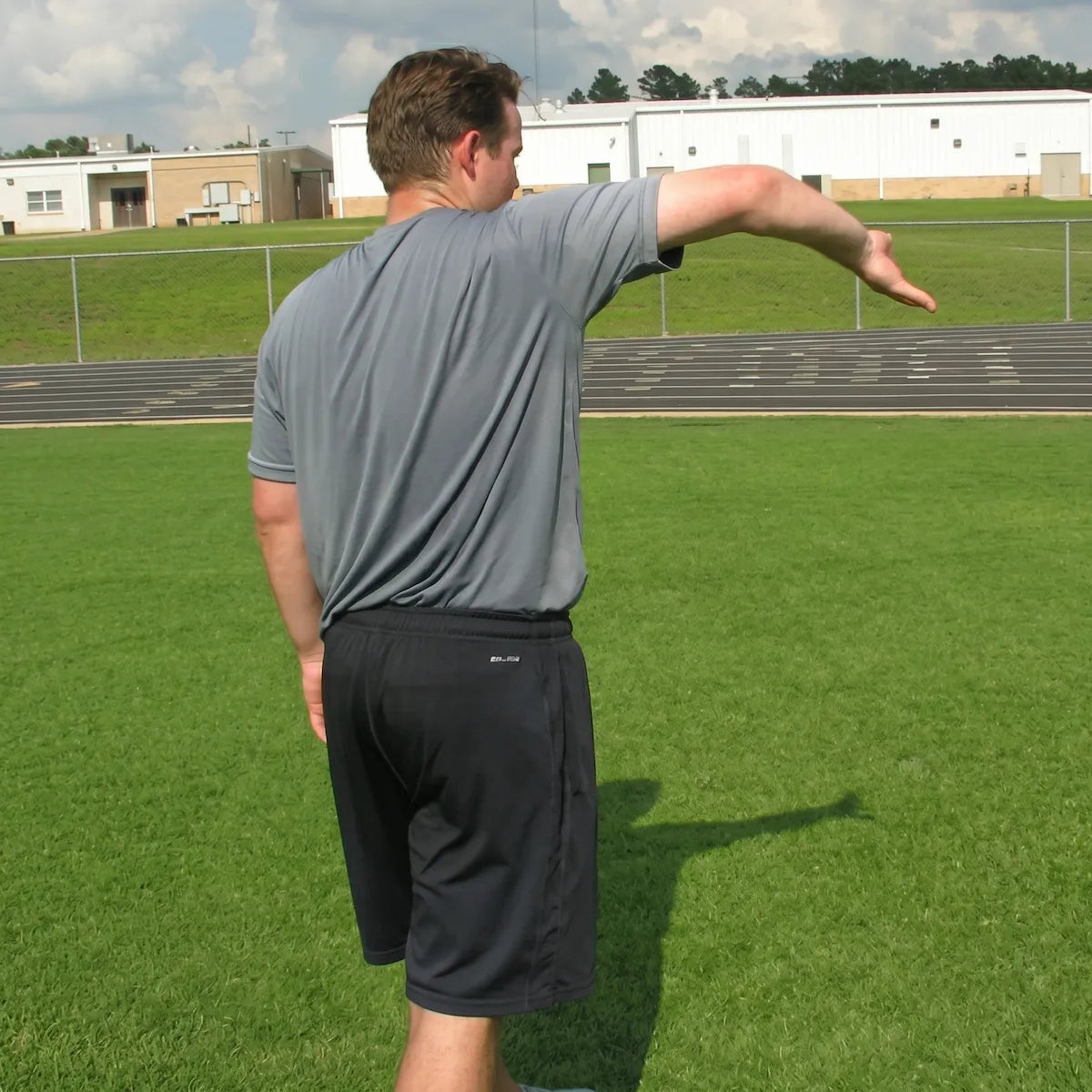 Arm engaged in a throwing motion, capturing dynamic shoulder rotation and elbow extension to illustrate explosive power, joint mobility, and neuromuscular coordination.