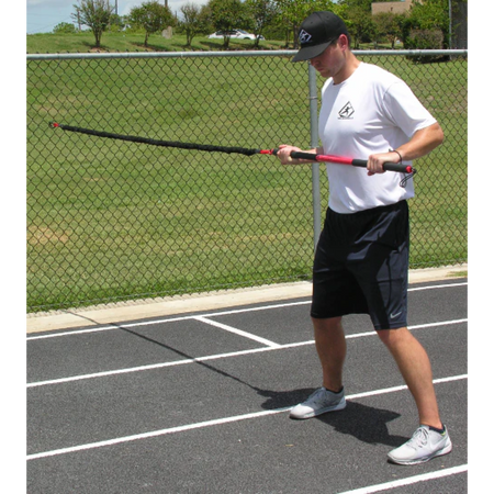Athlete preparing to perform a dynamic resistance exercise with the KHAOS® Pivoter, ensuring stability, control, and engagement before training.