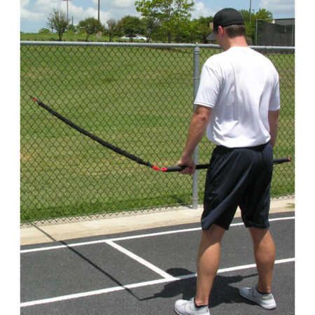 Athlete performing a dynamic resistance exercise with the KHAOS® Pivoter, engaging strength, stability, and control during functional training.