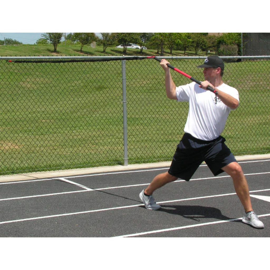 Athlete performing a resisted over-the-shoulder wood chopper with the KHAOS® Pivoter, engaging core rotation, upper-body strength, and dynamic stability during functional training.