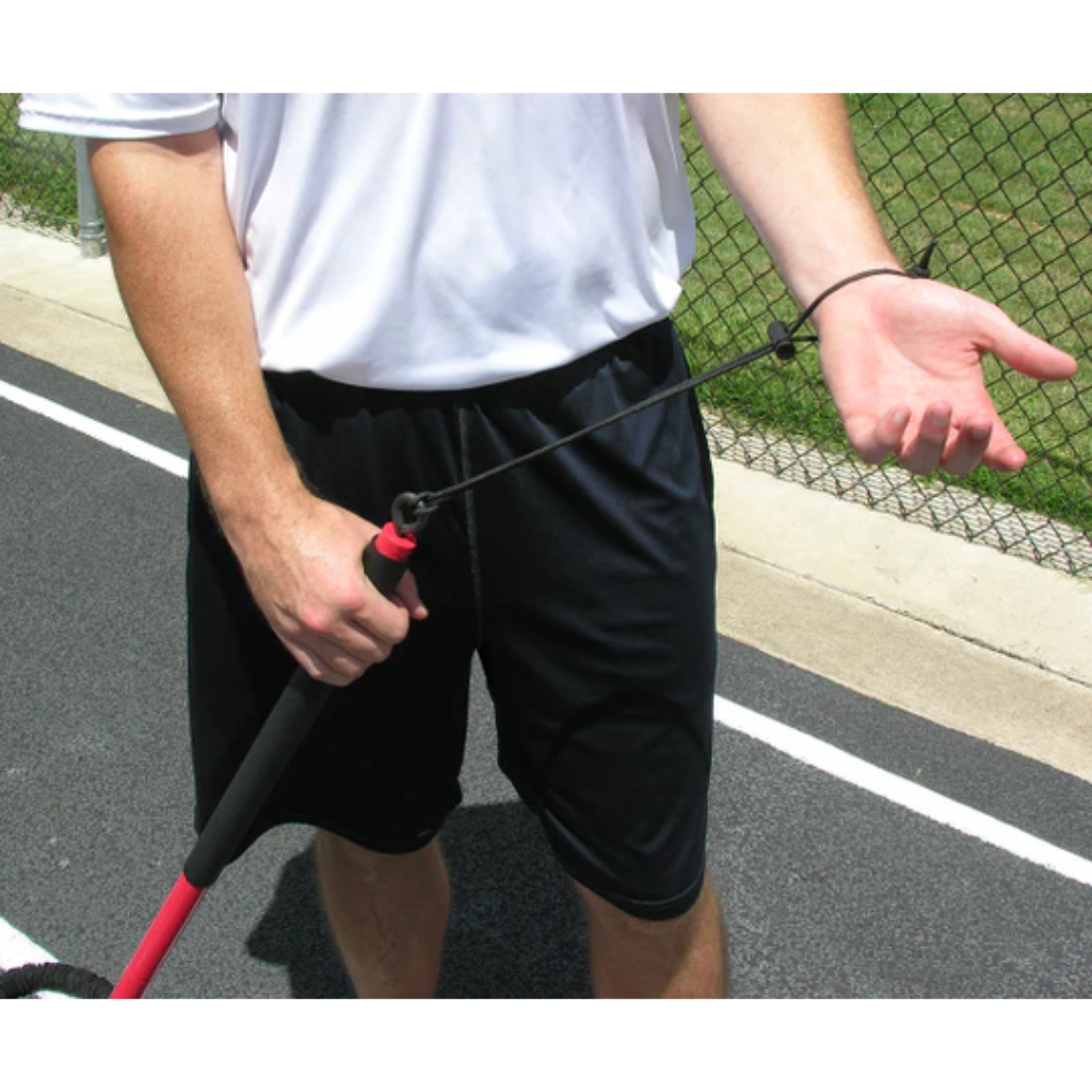 Athlete securing the Safety Wrist Strap of the KHAOS® Pivoter, ensuring stability and control before starting dynamic resistance training.