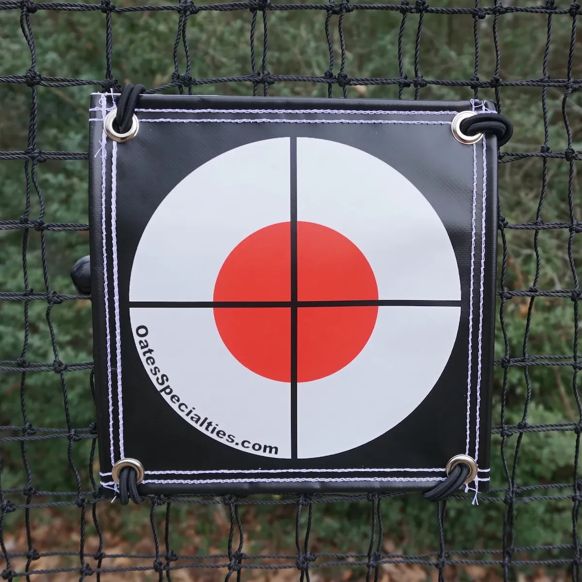 TAP® Precision Target attached to baseball training net close-up view showing bright orange target design.