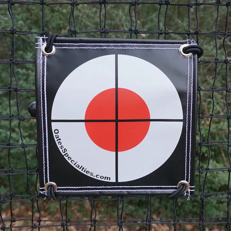 TAP® Precision Target attached to baseball training net close-up view showing bright orange target design.