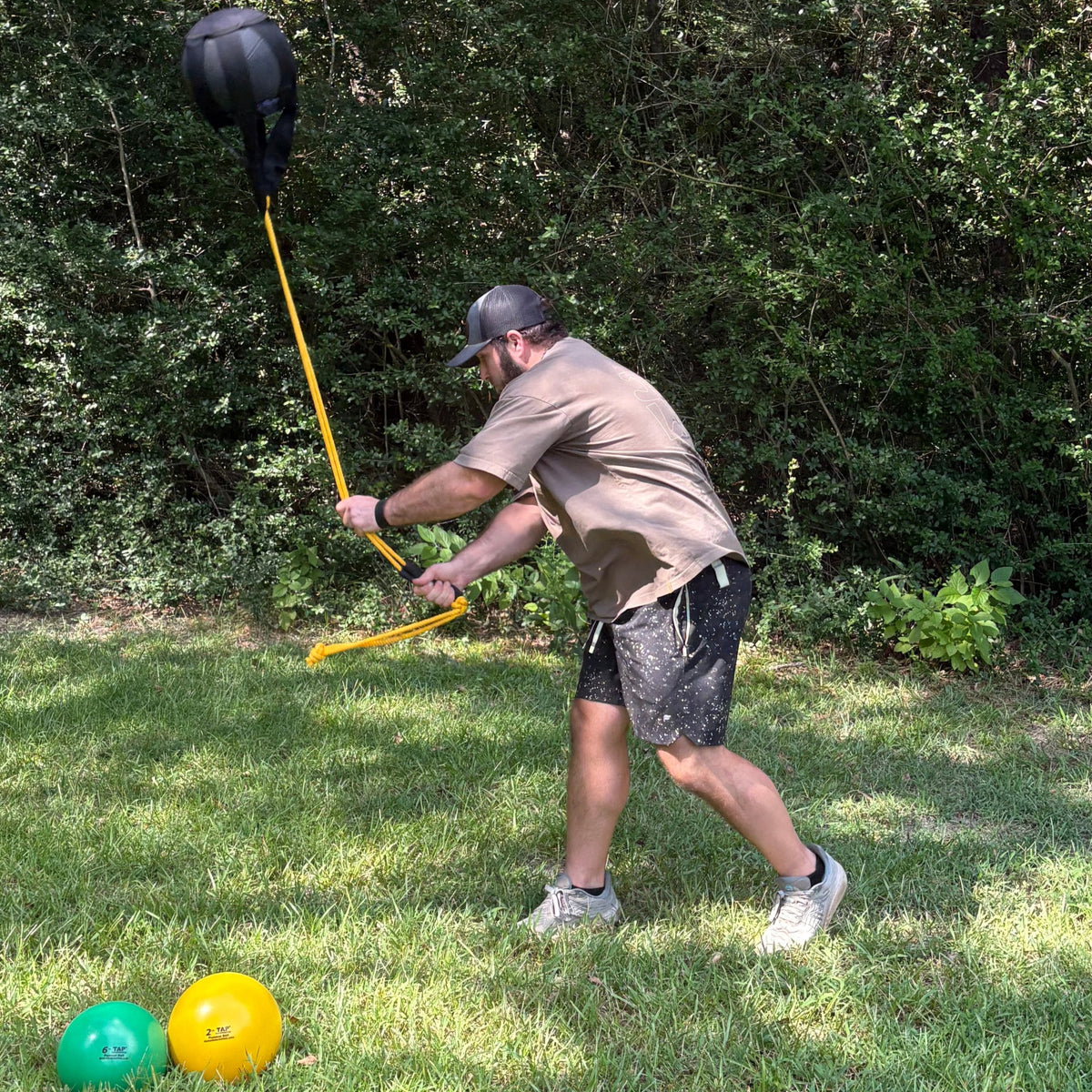 An athlete slams the Hammer Net and Speed Ball, which is part of the Speed and Power Bundle that is used to improve performance and mitigate the risk for injury on the field of play.