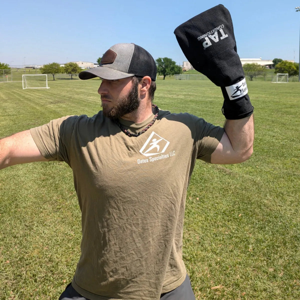 TAP® Baseball Training Sock: Pre-throw stance highlighting proprioceptive load mapping and kinetic chain organization through a constrained throwing environment.