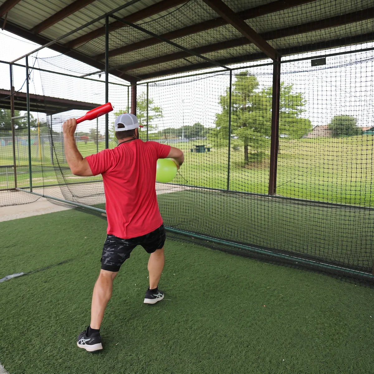 Athlete utilizing the TAP® Connection Throwing Club for distal-load organization and scapular stabilization to build throwing arm power.