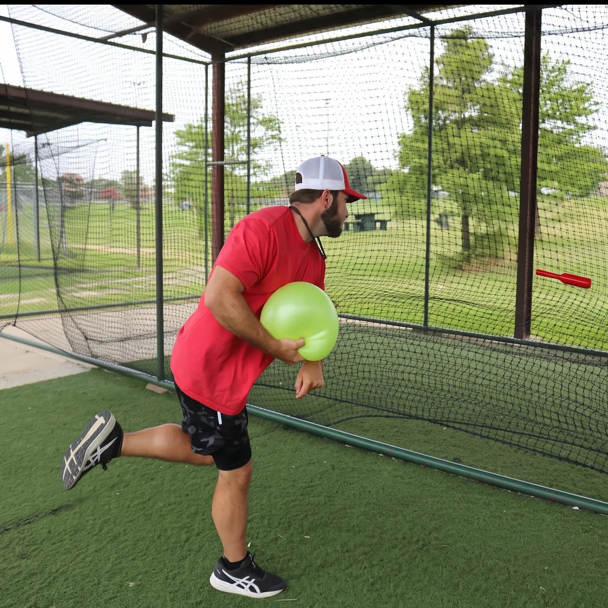 TAP® Connection Throwing Club shown at the moment of high-intent release, utilizing a distal-load stimulus for scapular stabilization and kinetic chain organization.