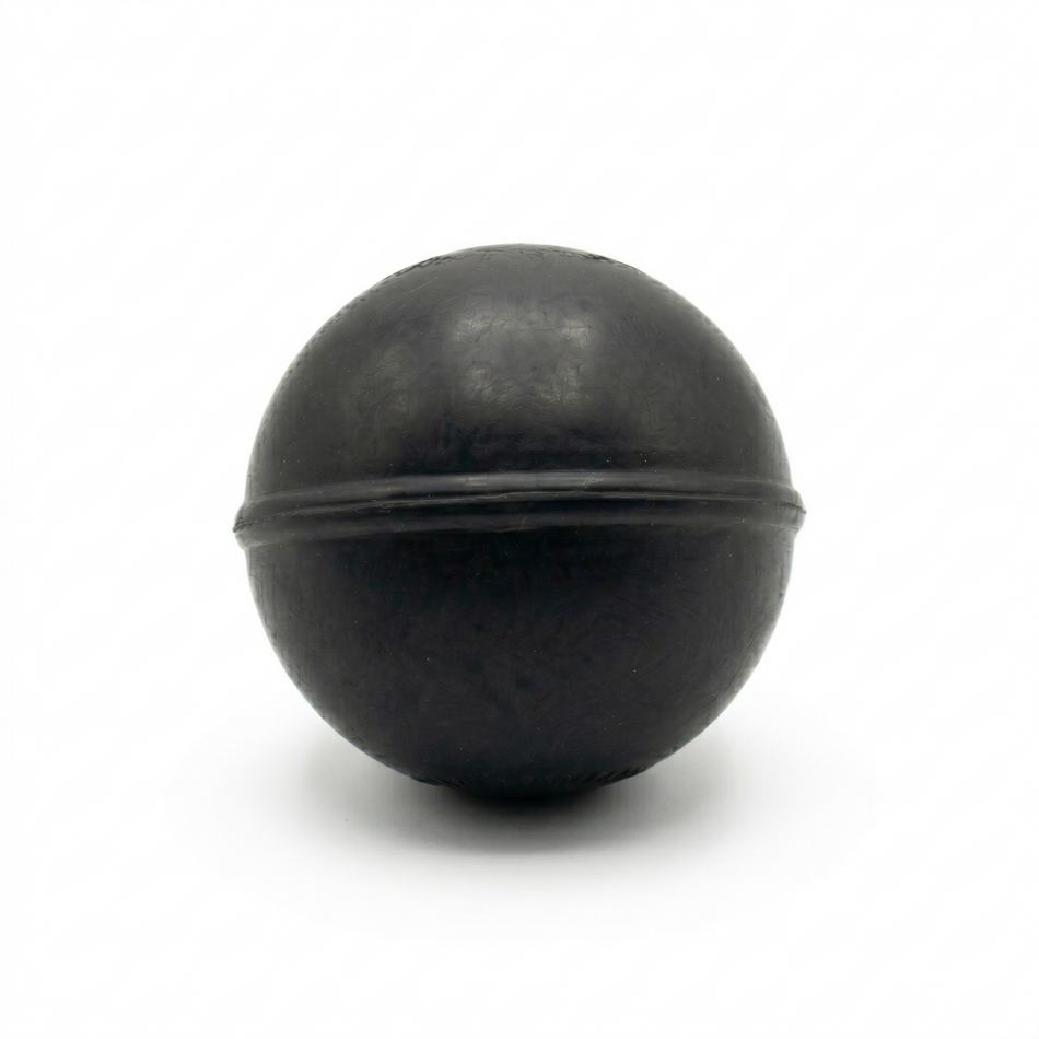 TAP® Weighted Massage Ball — 8 oz black version designed for deep tissue massage and myofascial release.