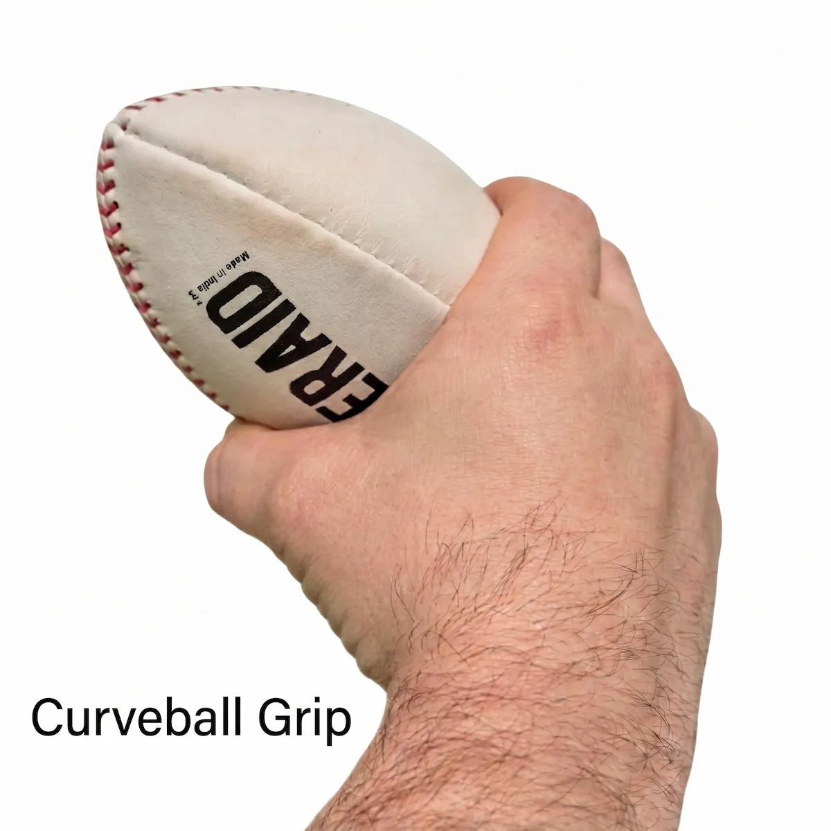 Hand holding the TAP® YAKKERAID in a curveball grip forward of center to train end‑over‑end tumble, topspin, and instant visual feedback on curveball break.