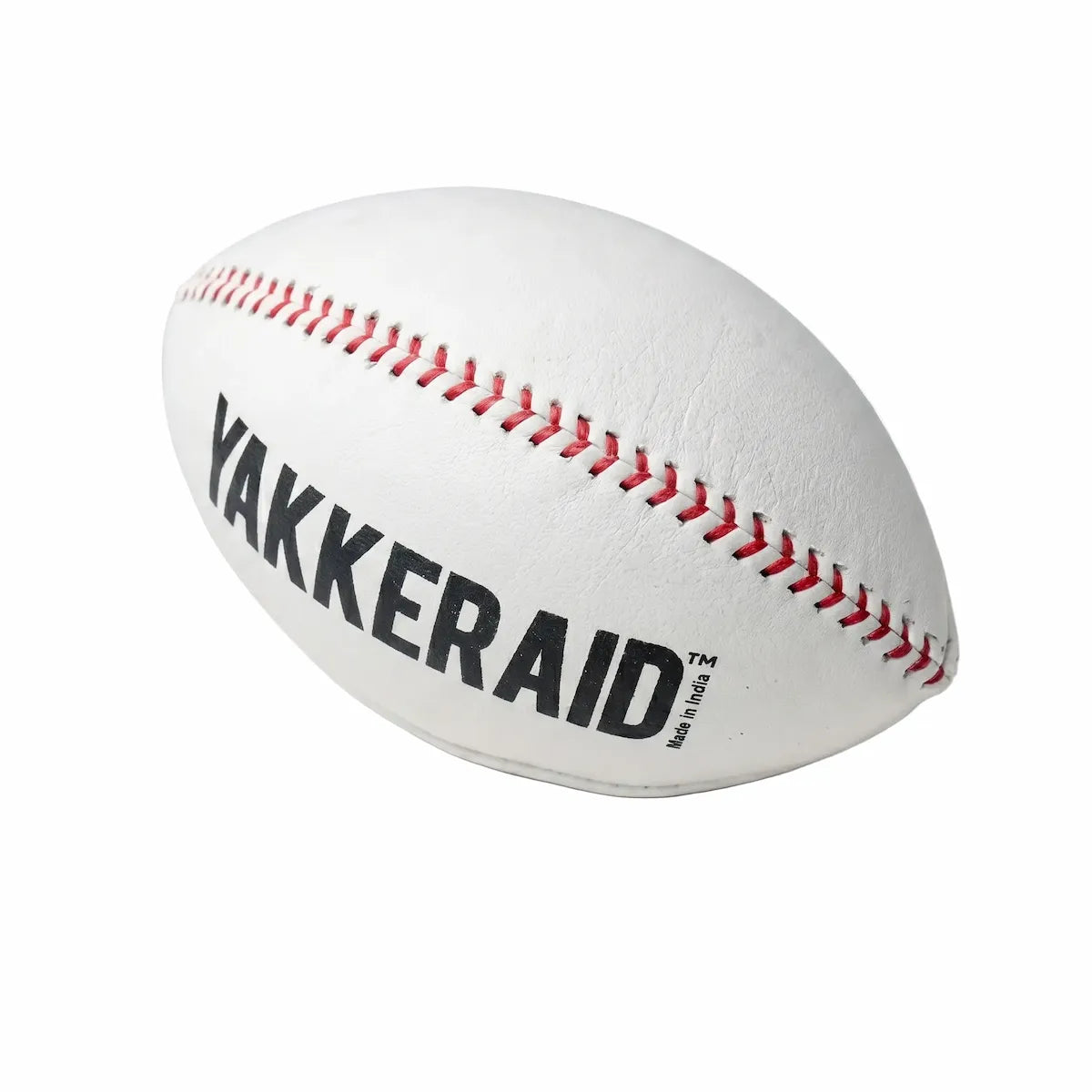 Side-angle view of TAP® YAKKERAID football-shaped baseball pitching trainer highlighting elongated profile and laces that make off-speed spin axis and grip feel easier to see and train.