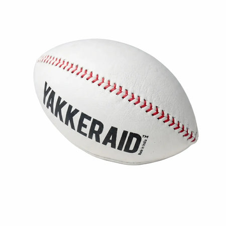Side-angle view of TAP® YAKKERAID football-shaped baseball pitching trainer highlighting elongated profile and laces that make off-speed spin axis and grip feel easier to see and train.