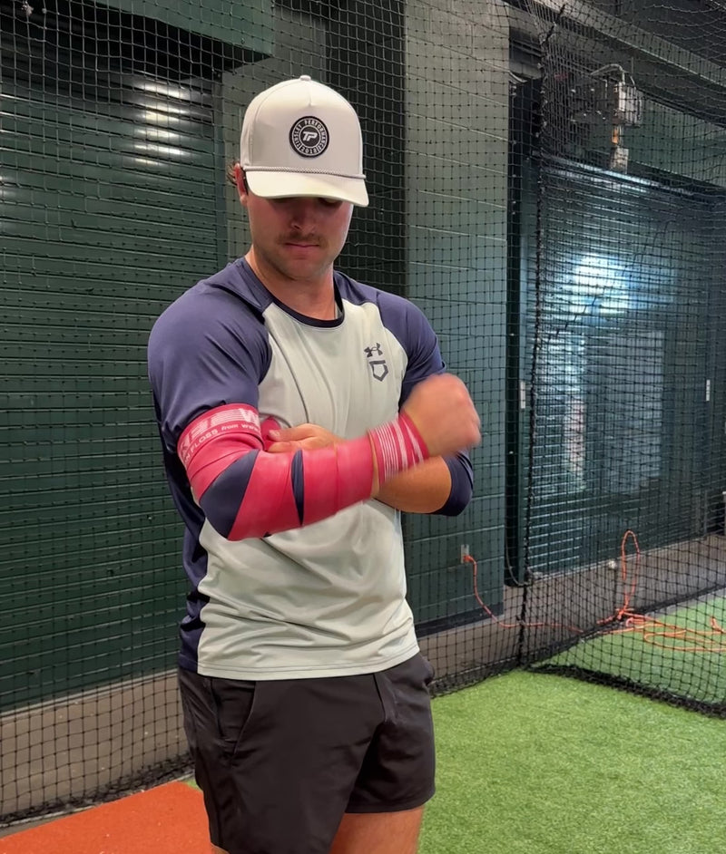 Controlled blood flow restriction and release with TAP® Rocket Wrap compression floss for faster post‑throw recovery and improved arm mobility for pitchers.