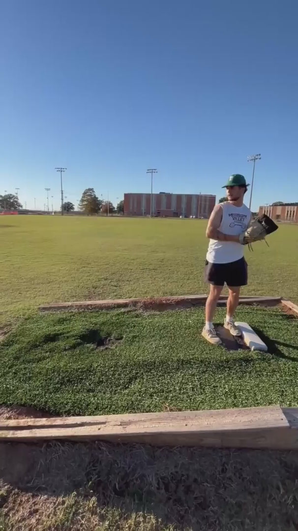 Pitchers demonstrating high-intensity throwing drills using the TAP® Baseball Training Sock. Video shows athletes performing full-speed mound and flat-ground deliveries, highlighting the "ball-in-hand" weighted resistance that allows for full-effort deceleration and arm care without releasing the baseball.