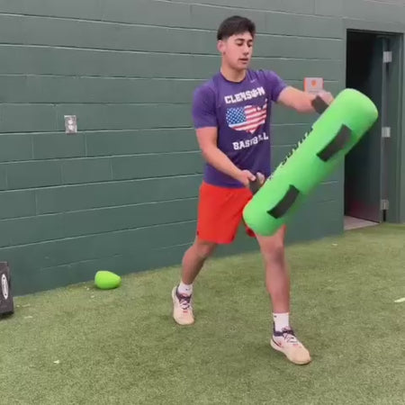 The Khaos® Waterboy for instability training: athletes managing the dynamic shifting of internal water weight to improve core stability, neuromuscular control, and deceleration patterning through unpredictable crashing forces.