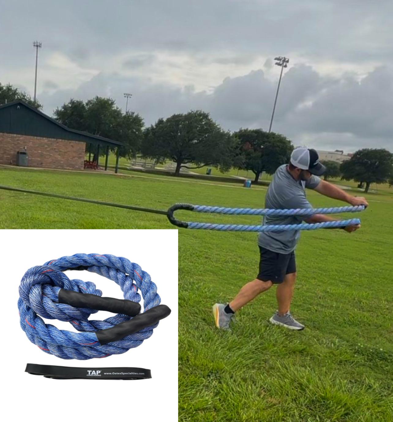 Action shot of a baseball player engaged in a rotational swinging drill using the Oates Specialties Dynamic Rope System. The athlete is pulling the short heavy rope against the anchored flat band, demonstrating a focus on developing core power and stability through accommodating resistance.