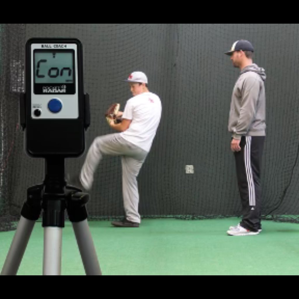 Ball Coach™ radar gun mounted on a tripod stand for hands-free velocity tracking during baseball or softball training sessions.
