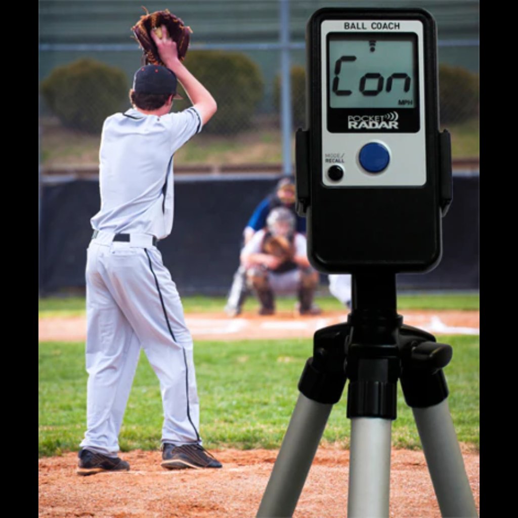 Ball Coach™ radar gun measuring the velocity of an incoming baseball pitch—providing real-time data for training and game analysis.